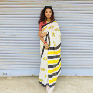 White Mulmul Saree featuring yellow taxi print and bold striped pallu.
